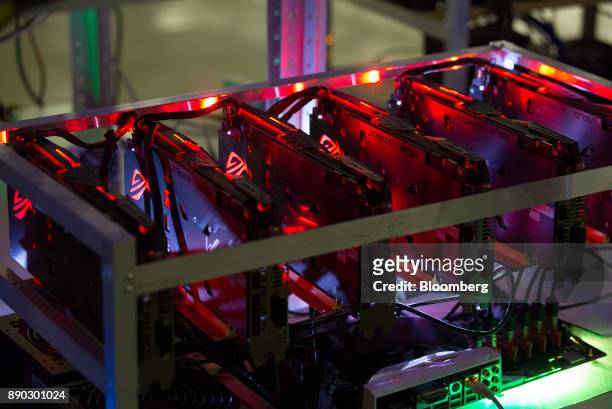 Cryptocurrency mining rig composed of Asus Strix machines operates at the SberBit mining 'hotel' in Moscow, Russia, on Saturday, Dec. 9, 2017....