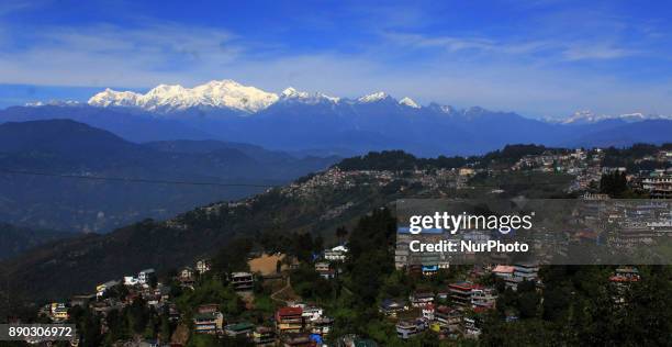 Light from a sunrise is cast on mountain Kangchenjunga near Darjeeling on December 11, 2017. Kangchenjunga is the third highest mountain in the world...