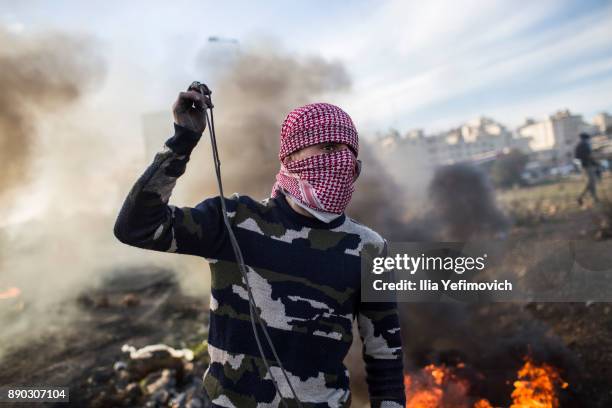 Palestinian youth clash with Israeli Defence Forces in the streets on December 11, 2017 in North of Ramallah, West-Bank. Protest continues into the...
