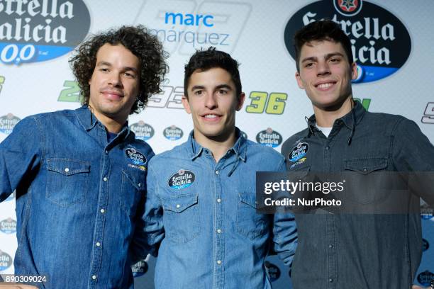MotoGP World Champion Marc Marquez of Spain, and Moto2 World Champion Franco Morbidelli of Italy pose for photographers during an advertising event...