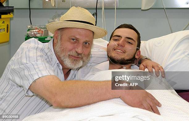 Richard Cass visits his son Jamie Neale at the Blue Mountains District ANZAC Memorial Hospital in Katoomba near Sydney on July 15, 2009 after the...