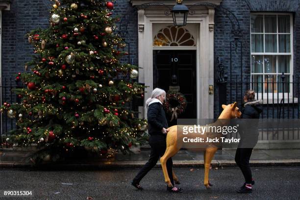 Decorative deer model is carried past Number 10 Downing Street on December 11, 2017 in London, England. British Prime Minister Theresa May is to...
