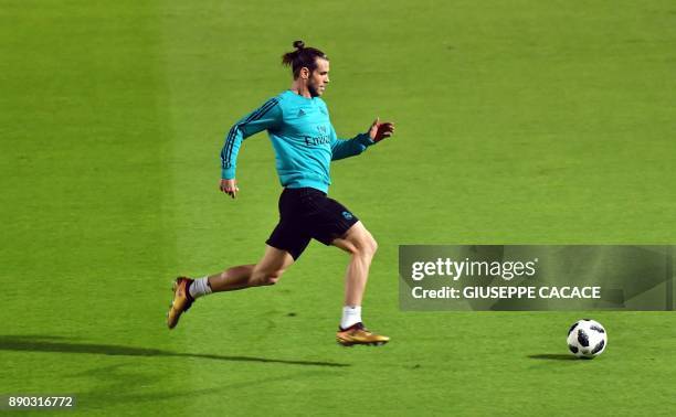 Real Madrid's Welsh forward Gareth Bale runs towards the ball on the pitch during a training session two days prior to his team's FIFA Club World Cup...