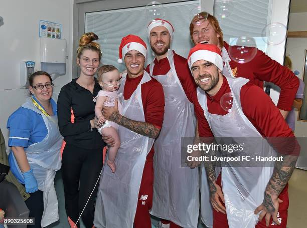 Jordan Henderson, Adam Bogdan, Danny Ings and Philippe Coutinho of Liverpool at their annual visit at Alder Hey Childrens Hospital on December 11,...