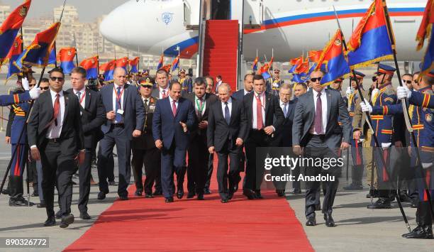 Russian President Vladimir Putin is welcomed by Egyptian President Abdel Fattah el-Sisi with an official ceremony on December 11, 2017 at Cairo...