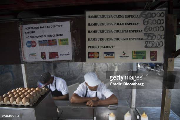 Sign indicating that credit cards are accepted is displayed at a food stand in the Chacao district of Caracas, Venezuela, on Wednesday, Dec. 6, 2017....
