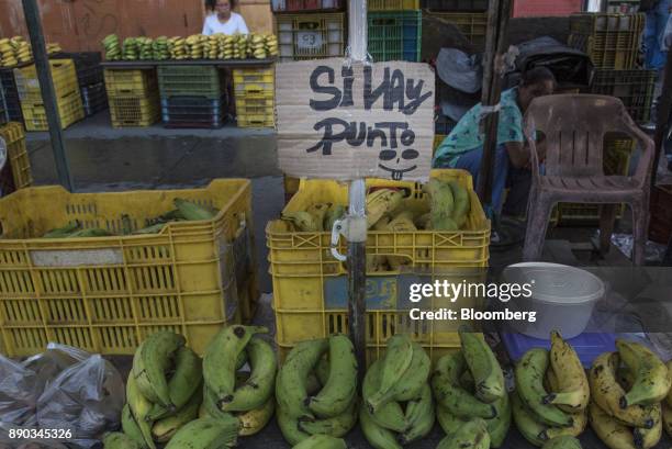 Sign indicating that credit cards are accepted is displayed at a banana stand in Petare, Miranda state, Venezuela, on Wednesday, Dec. 6, 2017....