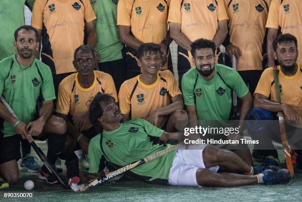 Dhanraj Pillai with his team International and opposition team Bandra Select poses for picture after exhibition match at St. Stanislaus sports...