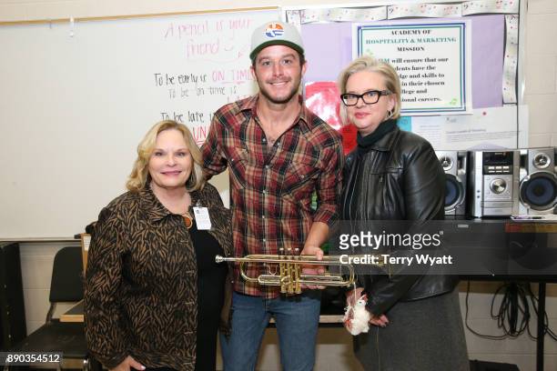 Dr. Nola Jones,Country Music Artist Easton Corbin and Pamela Virta during the Donation of Musical Instruments to Antioch High on December 11, 2017 in...