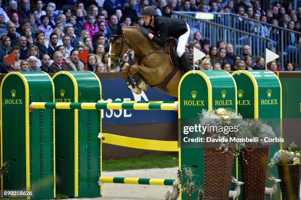 U2013 DECEMBER 09: Kevin STAUT of France, riding Reveur de Hurtebise HDC, during the 17th Rolex IJRC Top 10 Final. International Jumping Competition...