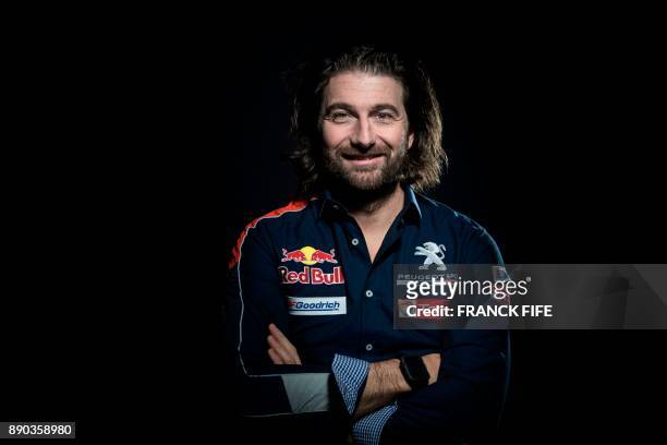 Peugeot's French co-driver David Castera poses during a photo session on December 7, 2017 in Paris. / AFP PHOTO / FRANCK FIFE