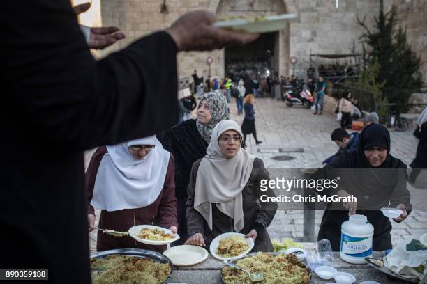 Women serve hot meals to protesters in front of the Damascus Gate at the entrance to the Old City on December 11, 2017 in Jerusalem, Israel. In an...