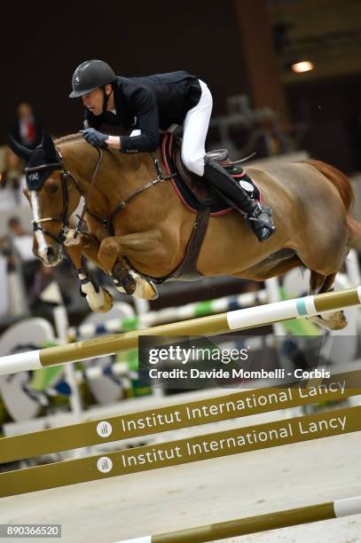 U2013 DECEMBER 09: Kevin STAUT of France, riding Reveur de Hurtebise HDC, during the 17th Rolex IJRC Top 10 Final. International Jumping Competition...