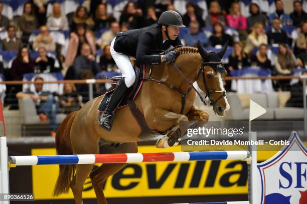 U2013 DECEMBER 09: Kevin STAUT of France, riding Reveur de Hurtebise HDC, during the 17th Rolex IJRC Top 10 Final. International Jumping Competition...