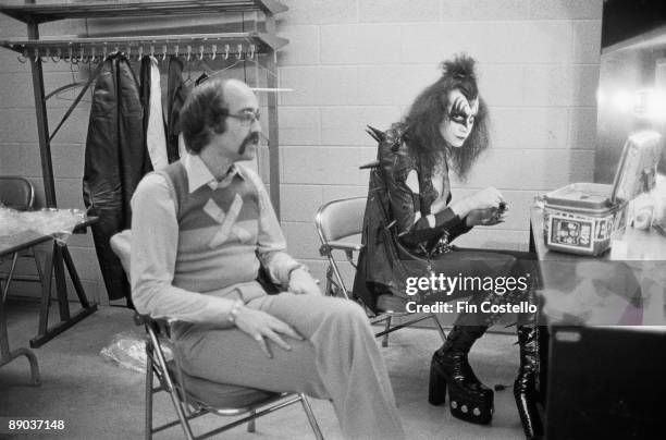 Gene Simmons, the vocalist of hard rock band KISS, backstage in Detroit with Larry Harris, May 1975. Harris is the co-founder of Casablanca Records,...