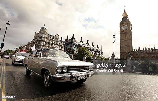 Convoy of Vauxhall cars drives around Parliament Square in Westminster in a protest to campaign to safeguard workers' jobs on July 15, 2009 in...