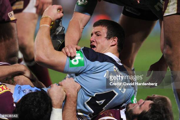 Josh Morris of the Blues scores a try during game three of the ARL State of Origin series between the Queensland Maroons and New South Wales Blues at...