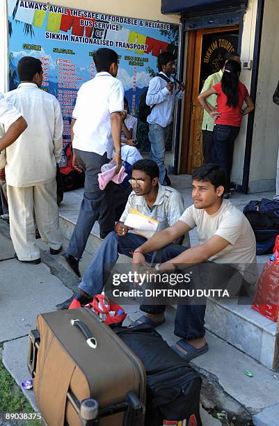 Indian bus passenger are stranded at the Sikkim Bus Terminus in Siliguri, on July 15, 2009 due an indefinite strike on its third day in Darjeeling,...