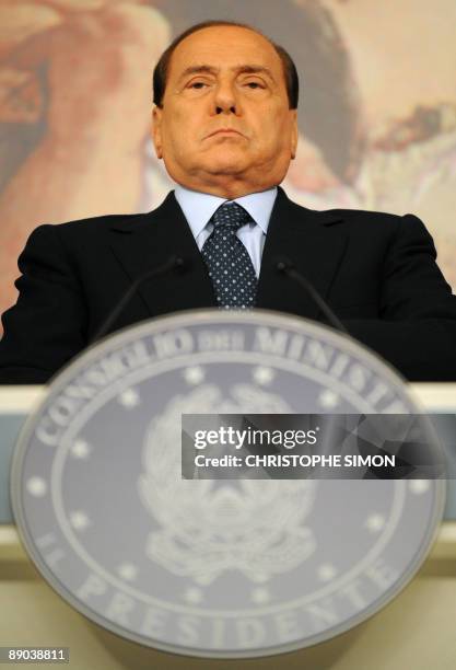 Italian Prime Minister Silvio Berlusconi gives a press conference following a ministers' council on July 15 at Palazzo Chigi in Rome. Italian...