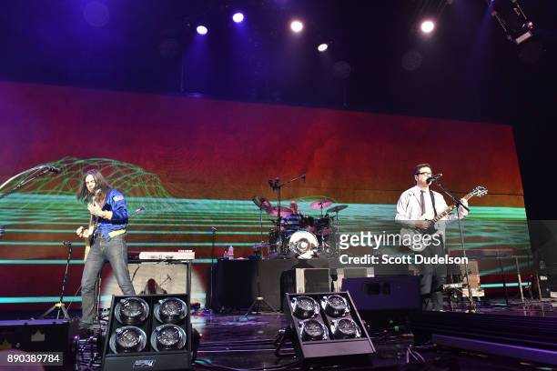 Musicians Brian Bell , Patrick Wilson and Rivers Cuomo of the band Weezer perform onstage during night two of KROQ Almost Acoustic Christmas 2017 at...