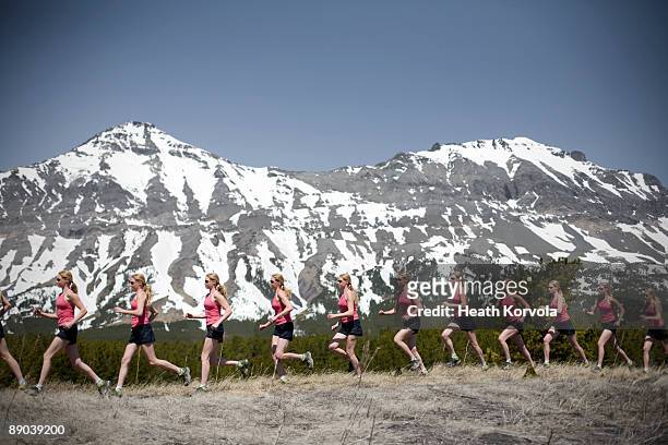 multiple exposure of woman running in mountains. - double exposure running stock pictures, royalty-free photos & images