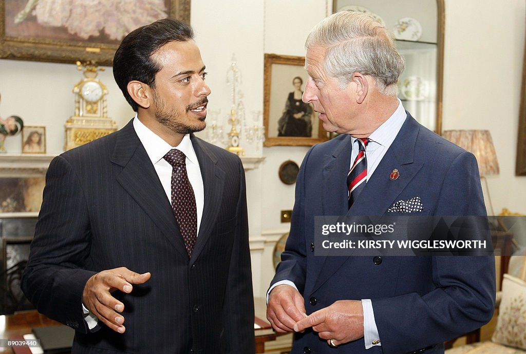 Britain's Prince Charles, (R) meets Shei