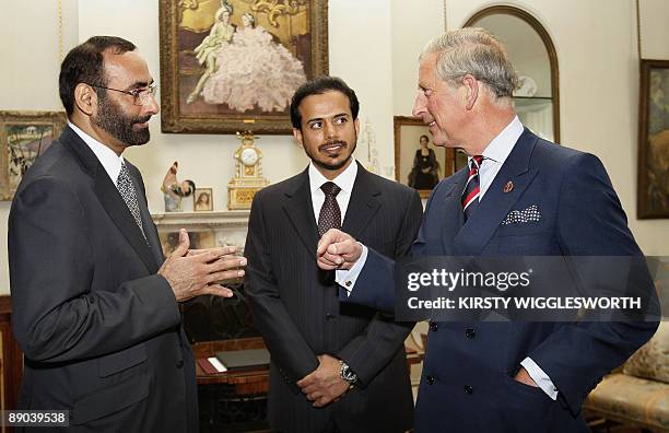 Britain's Prince Charles meets Sheikh Sultan bin Tahnoon Al Nahyan, the head of Abu Dhabi's tourism authority, and Mohammed Al Bowardi, Secretary...