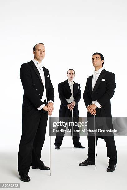 three men in tuxedos with canes - bastón para bailar fotografías e imágenes de stock