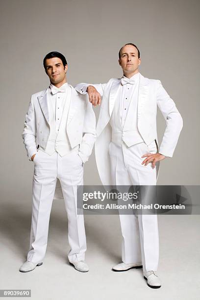 two men in white tuxedos standing - smoking activity stock-fotos und bilder