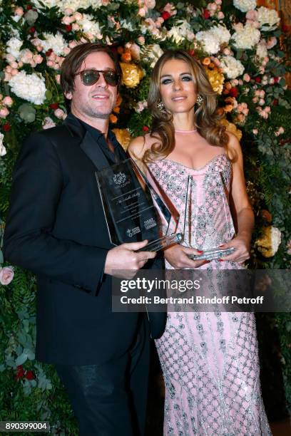 Support of "Action Contre La Faim", singer Thomas Dutronc and Support of "Breast Cancer Research Foundation", actress Elizabeth Hurley attend Indian...