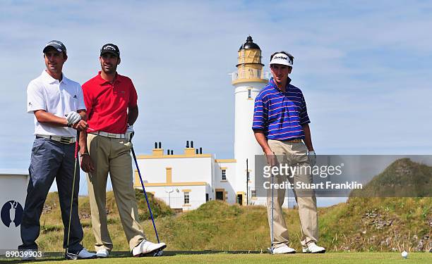 Rafa Echenique of Argentina, Alvaro Quiros of Spain and Gonzalo Fernandez-Castano of Spain wait to tee off during a practice round prior to the 138th...