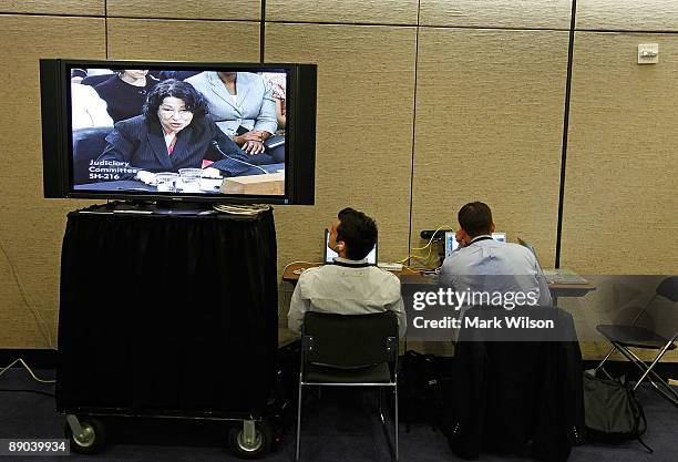 Reporters sit outside the hearing room and watch Supreme Court nominee Judge Sonia Sotomayor testify on the third day of confirmation hearings before...