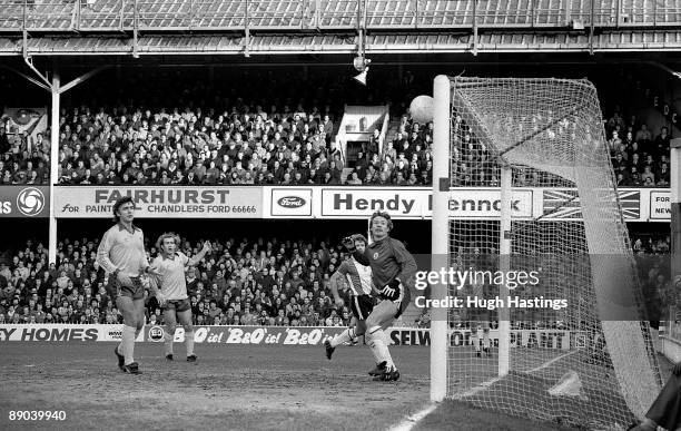 Chelsea players Mike Fillery and Clive Walker can only look on as the ball heads towards goal during the FA Cup Third Round match between Southampton...