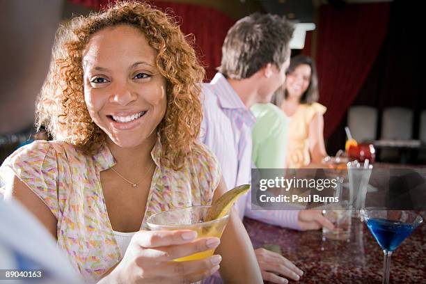 men and women sharing cocktails at bar - speed dating stockfoto's en -beelden