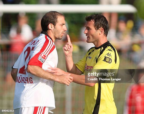 Alexander Frei of Dortmund and Javier Pinola of Nuremberg are arguing during the pre-season friendly match between 1. FC Nuernberg and Borussia...