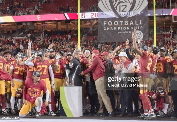 The USC Trojans celebrate winning the Pac-12 Championship game against the Stanford Cardinal on December 1, 2017 at Levi's Stadium in Santa Clara,...