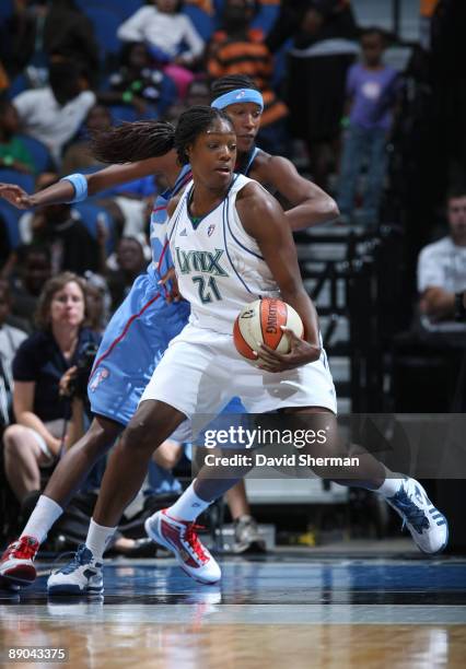 Nicky Anosike of the Minnesota Lynx goes for the basket against Michelle Snow of the Atlanta Dream during the game on July 15, 2009 at the Target...