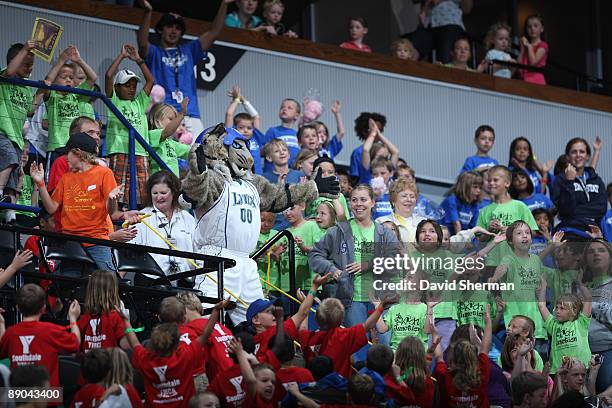 Fans watch Prowl perform one of his stunts during the game between the Minnesota Lynx and the Atlanta Dream on July 15, 2009 at the Target Center in...