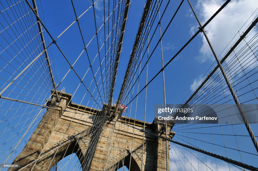 Brooklyn Bridge against blue sky