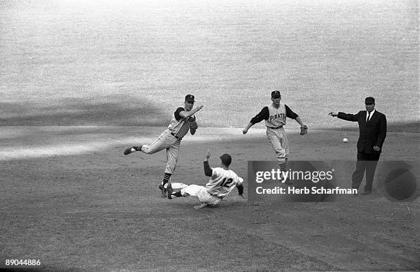 World Series: Pittsburgh Pirates Bill Mazeroski in action, turning double play vs New York Yankees Gil McDougald . Game 4. Bronx, NY 10/9/1960...