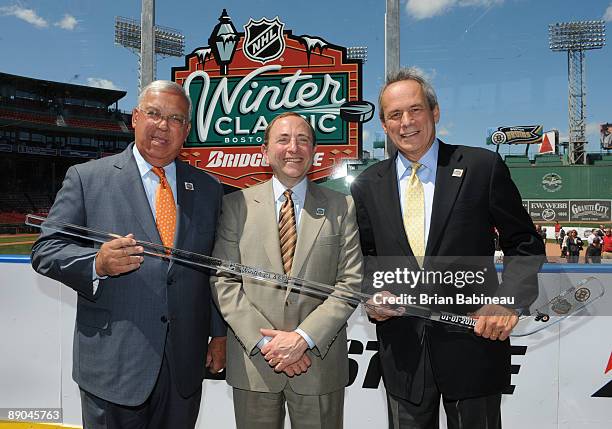 Boston MayorTom Menino, NHL Commissioner Gary Bettman and Boston Red Sox GM Larry Lucchino pose during a press conference making the announcement of...