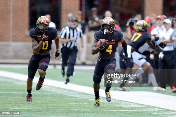 Darnell Savage Jr. #4 of the Maryland Terrapins returns an interception for a touchdown against the Towson Tigers on September 9, 2017 in College...