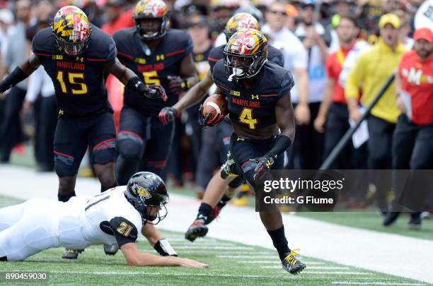 Darnell Savage Jr. #4 of the Maryland Terrapins returns an interception for a touchdown against the Towson Tigers on September 9, 2017 in College...