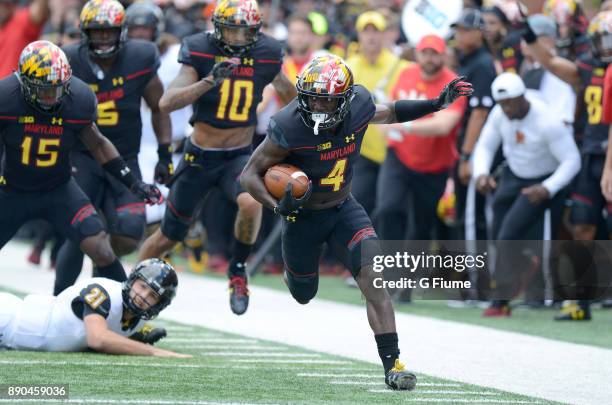 Darnell Savage Jr. #4 of the Maryland Terrapins returns an interception for a touchdown against the Towson Tigers on September 9, 2017 in College...