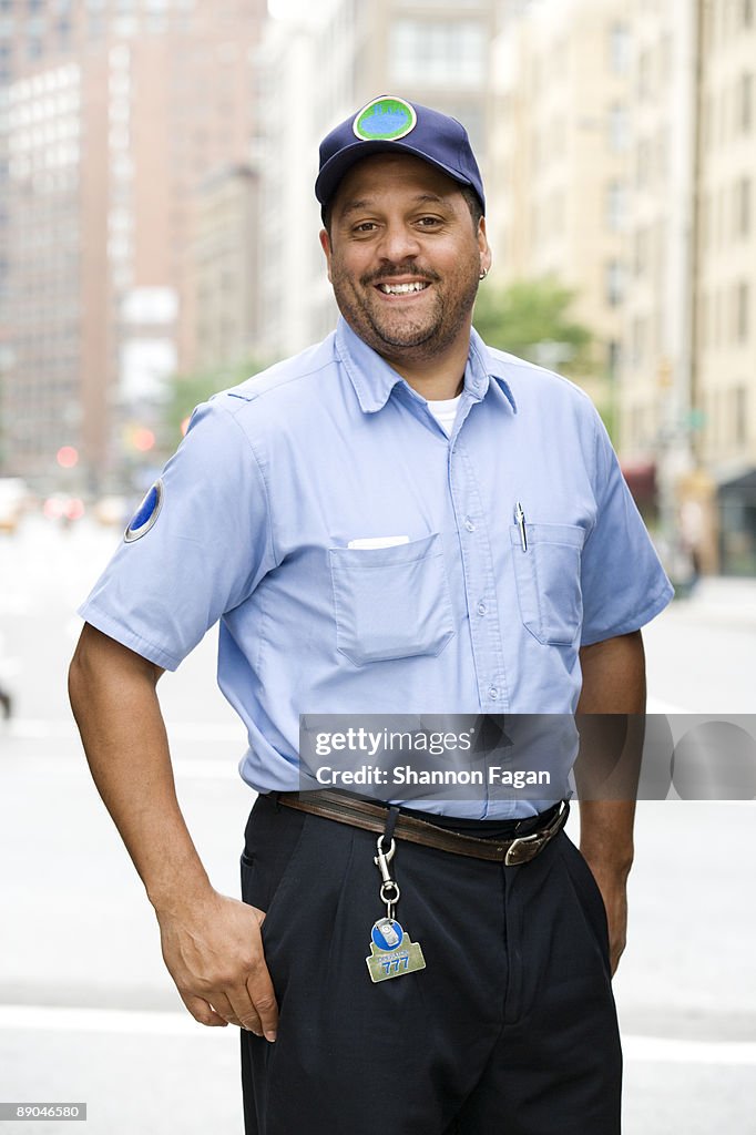 Male Bus Driver Standing Outside on City Street