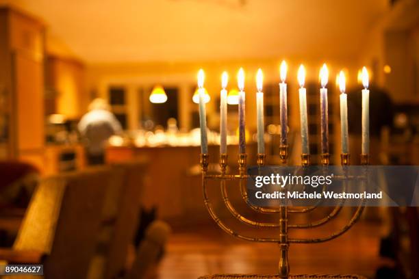 lit menorah in home - chanoeka stockfoto's en -beelden