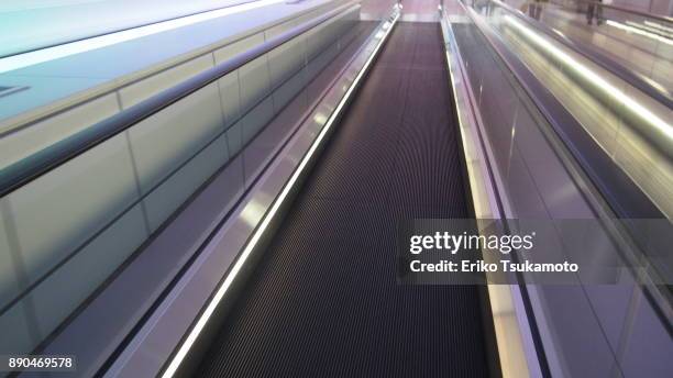 moving walkway - travolator stock pictures, royalty-free photos & images