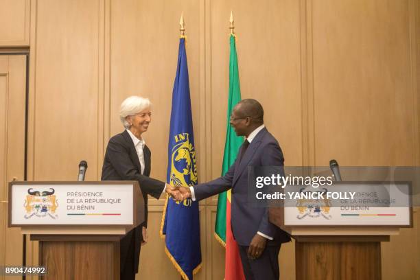 International Monetary Fund Managing Director Christine Lagarde shakes hands with Benin President Patrice Talon during a joint press conference in...