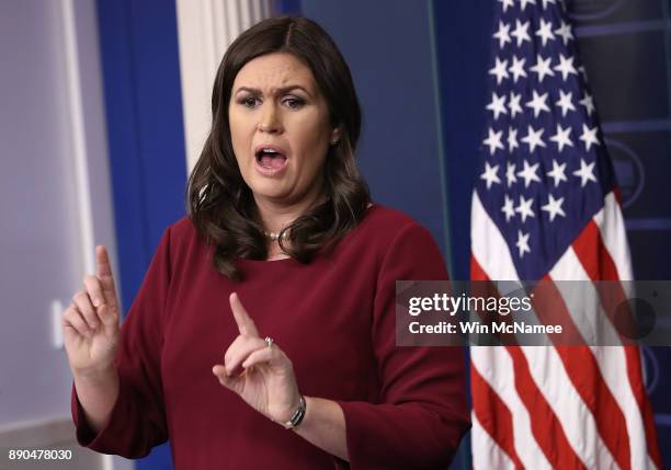 White House press secretary Sarah Huckabee Sanders answers a question during the daily briefing at the White House December 11, 2017 in Washington,...
