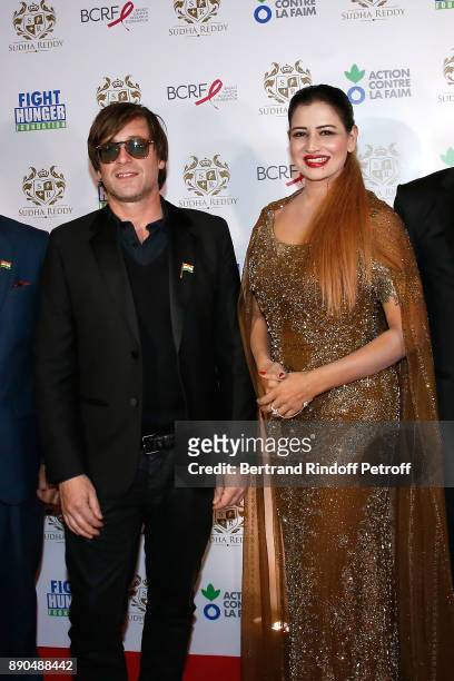 Support of "Action Contre La Faim", singer Thomas Dutronc and Indian millionaire Sudha Reddy attend Sudha Reddy gives 135000 Euros to the "Action...